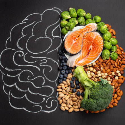 Chalk hand drawn brain with assorted food, food for brain health and
